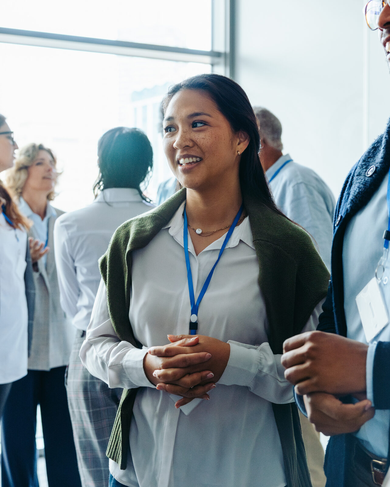 Smiling professionals mingling at a networking event