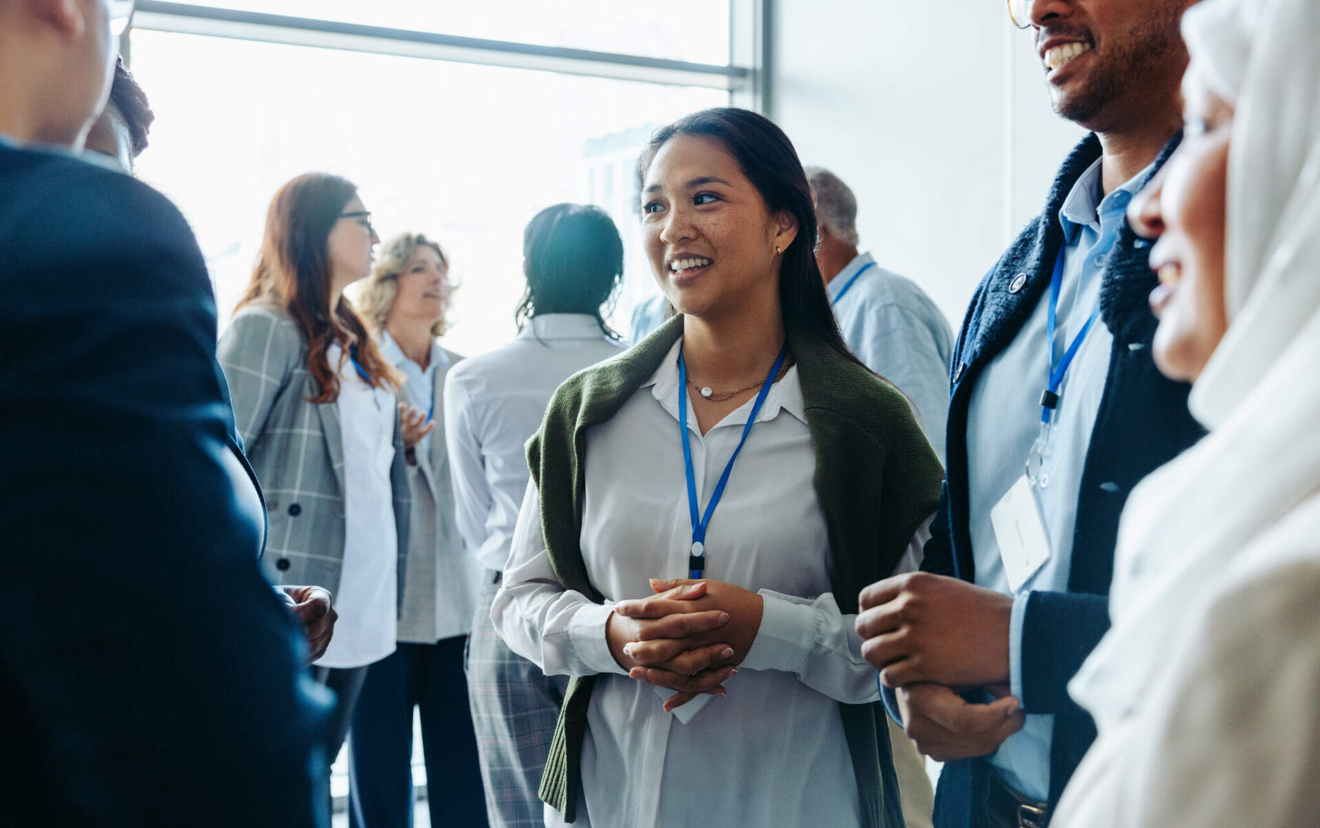 Smiling professionals mingling at a networking event